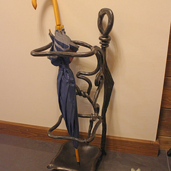 An exclusive wrought iron umbrella holder