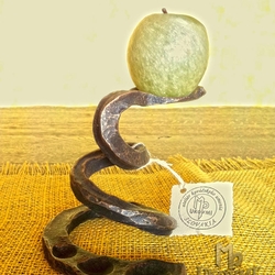 A wrought iron candleholder - A snake