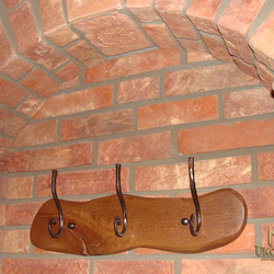 A wrought iron hanger combined with wood - wrought iron furniture