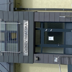 Sign on a church, made of stainless steel Sign on a church, made of stainless steel
