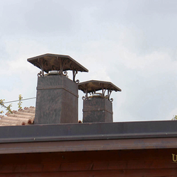A wrought-iron chimney roof