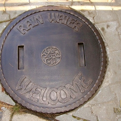 A wrought iron well cover