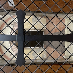 A wrouhgt iron grilles with a cross in the historic church in Ľubica A wrouhgt iron grilles with a cross in the historic church in Ľubica