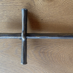 A wrought iron wall cross - religious objects