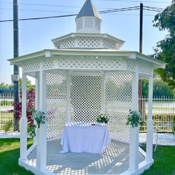 Decorated garden wedding gazebo ready for the wedding ceremony