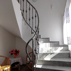 Helical staircase railing in a family home – forged railing Helical staircase railing in a family home – forged railing