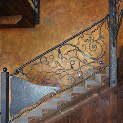Hand wrought iron interior staircase railing - Roots