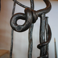 A wrought iron knot on a railing A wrought iron knot on a railing