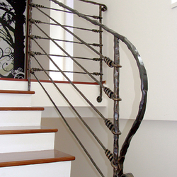 A wrought iron stair railing - Knot pattern
