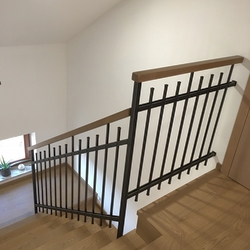 Forged interior railing with a wooden handle – simple design Forged interior railing with a wooden handle – simple design