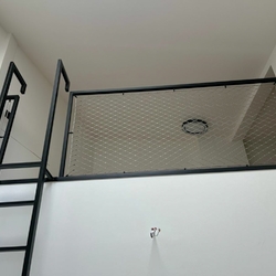 The use of space in high rooms will be ensured by a modern metal railing with a ladder The use of space in high rooms will be ensured by a modern metal railing with a ladder