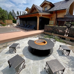 Multifunctional fire pit with grill, wood storage space, and forged chairs Multifunctional fire pit with grill, wood storage space, and forged chairs