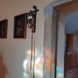 A wrought iron bell holder by the church door - Tvarožná (Slovakia) A wrought iron bell holder by the church door - Tvarožná (Slovakia)